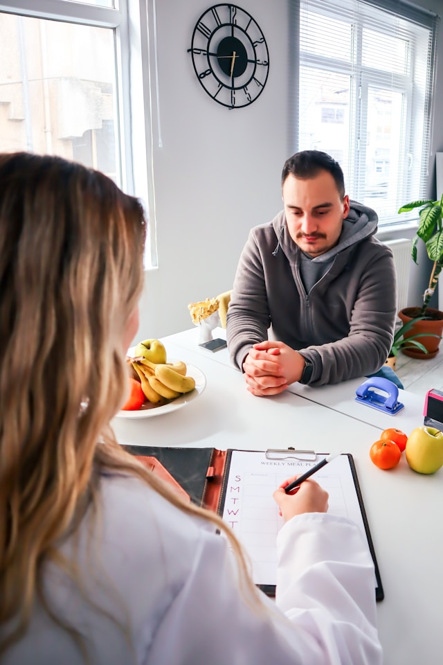man sitting at table with Mission Viejo nutrition coach